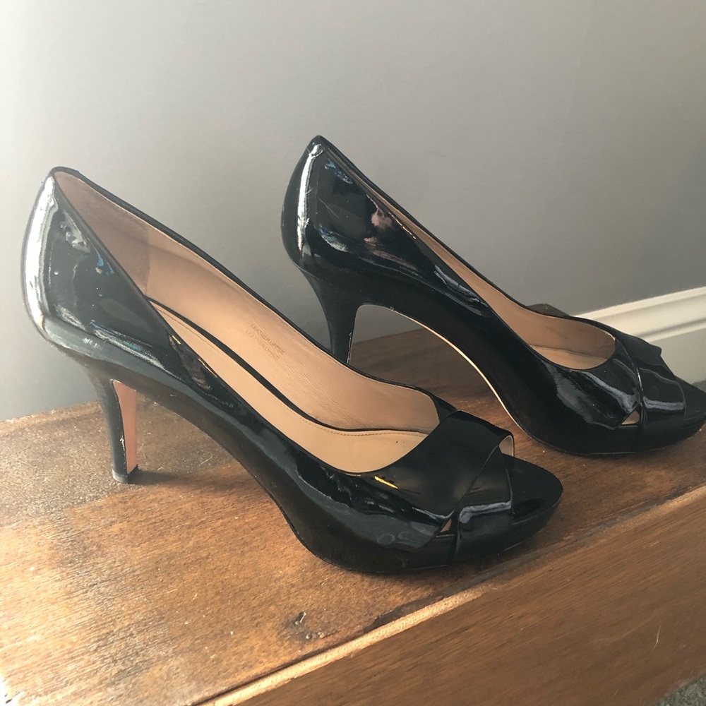 Via Spiga black patent pumps.